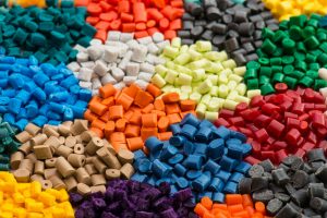 Close up image of plastic pellets in various colours