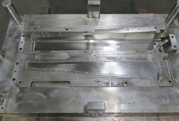 Interior of plastic injection molding tool showing mold quality and precision tooling design